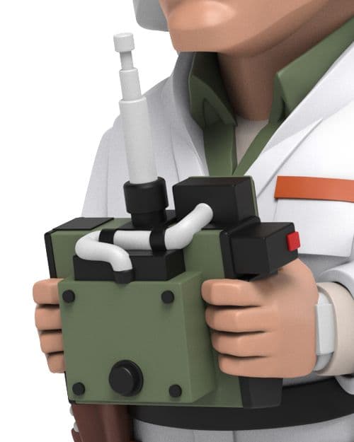 Close-up of Doc Brown's upper torso in white coat, green shirt, his hands holding a green remote control device