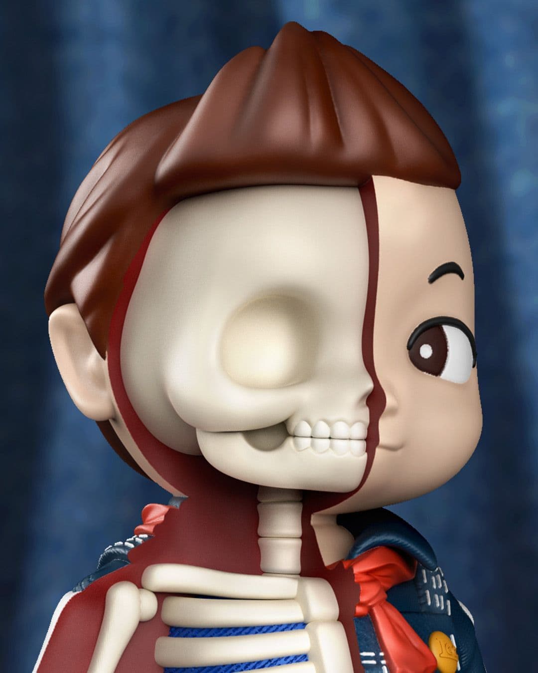 Close-up of boy figure’s head, showing half-normal face and half-exposed. skull with smooth sculpted detail.