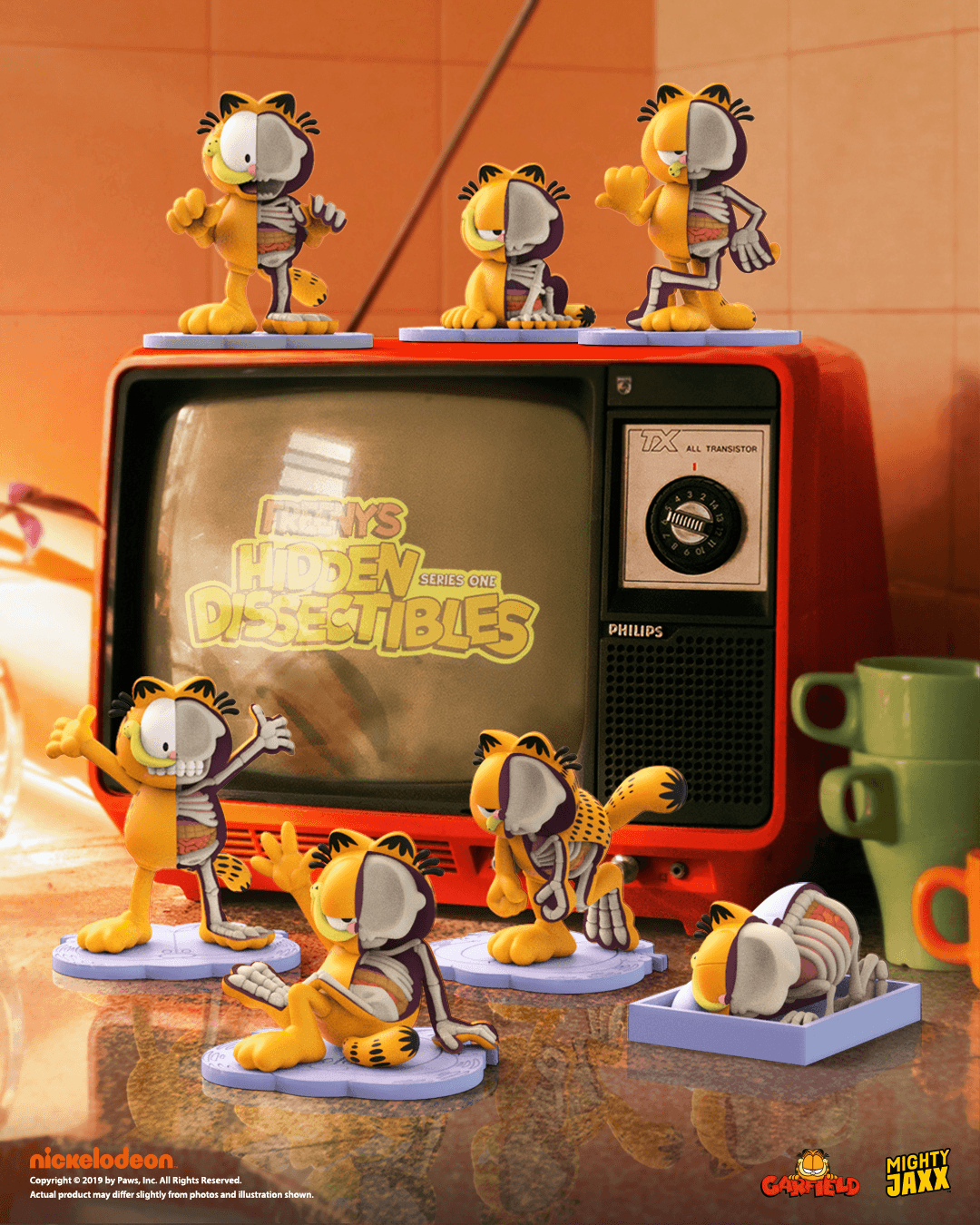 Garfield x Mighty Jaxx card, nickelodeon branding and artist Jason Freeny credits in a retro TV with figurines placed around.