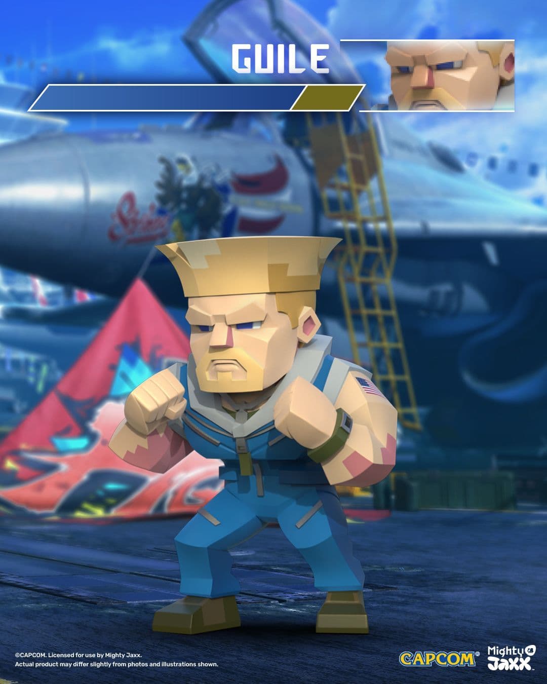 Guile figure with short blonde hair in blue combat gear, in battle pose with fists clenched and ready, near a jet runway.